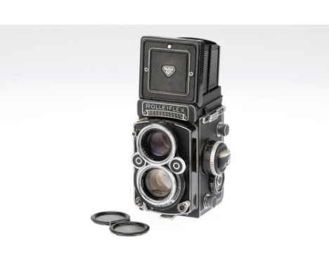 A Rollei Rolleiflex 2.8 F Medium Format TLR Camera, black, sderial no. 2451565, body G, shutter working, meter responds to li