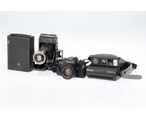 Two Zeiss Ikon Folding Cameras and a Pentax SLR Camera comprising a Zeiss Ikon Maximar 207/7 plate camera, 1930s, for 9 x 12c