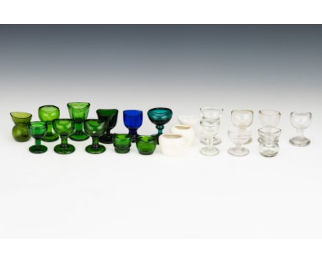 A Collection of Early Glass &amp; Ceramic Eyebaths, comprising of 1 blue eyebath (chipped), 9 green eyebaths, 1 turquoise eye