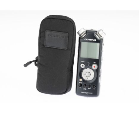 An Olympus LS-10 Linear PCM Recorder, complete with wireless remote control, powers up and appears to function, complete with