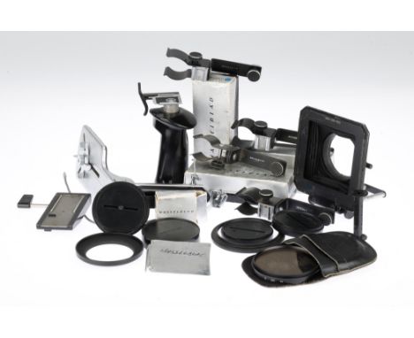 A Selection of Hasselblad Camera Accessories including a Proshade lens hood for 80 to 250mm lenses, four caps, four adjustabl