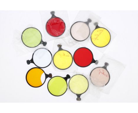 A Selection of Linhof 70mm Drop-In Filters, to include a red 1, a yellow-green 1, a yellow 2, an R3 (1x) an R6 (1.5x), a yell