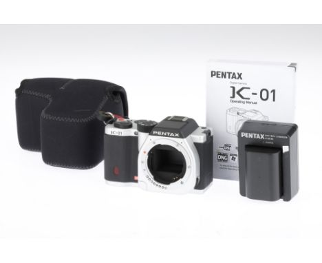 A Pentax K-01 Digital Camera, silver, serial no. 2665082, body, VG-E, powers up but not tested beyond this point, complete wi