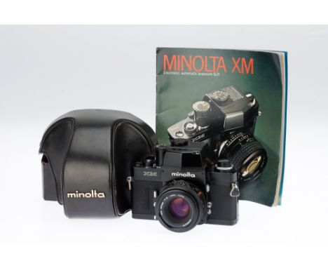 A Minolta XM 35mm SLR Camera black, 1973, serial no.2128028, with a MD f/2 50mm lens, shutter working at B &amp; X without ba