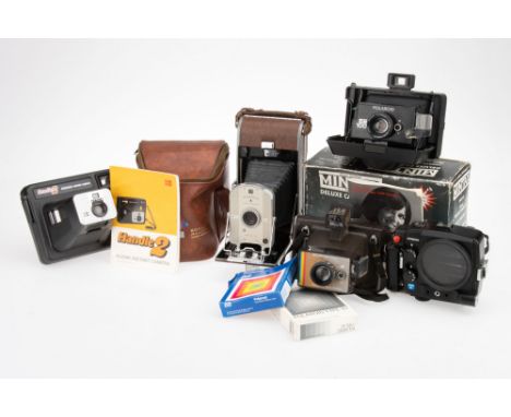A Group of Instant Film Cameras a Polaroid Model 95 Land camera, a Polaroid EE 100 Special Land camera, a Polaroid Colour Swi