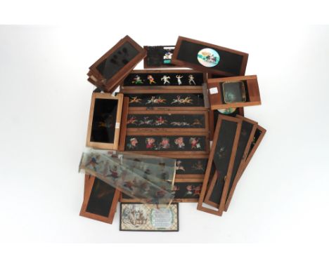 A Large Collection of Victorian Magic Lantern Slides, including 9 mahogany framed cartoon-type slip slides, a slip slide of a