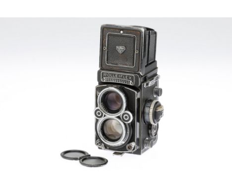 A Rollei Rolleiflex 2.8 F Medium Format TLR Camera, black, serial no. 2445999, body G, shutter working but requires service, 