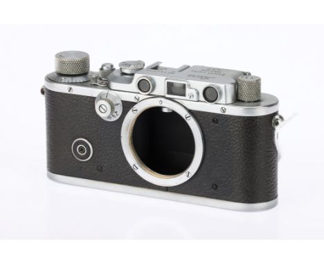 A Leica III 35mm Rangefinder Camera, 1934, chrome, serial no. 140272, body G, shutter working, some repair to the second curt