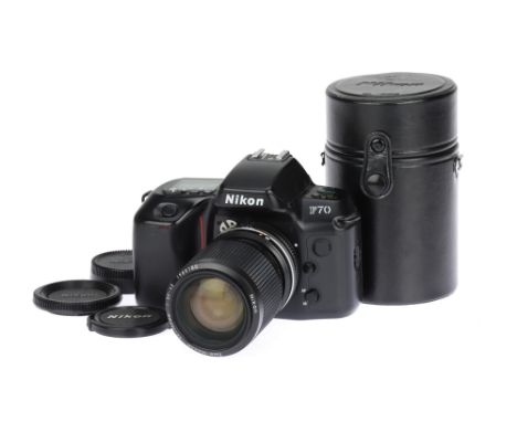 A Nikon F70 SLR Camera black, 1994, serial no.2841588, with a Zoom-Nikkor f/3.5-4.5 35-105mm AI-S lens, serial no.1985180, sh