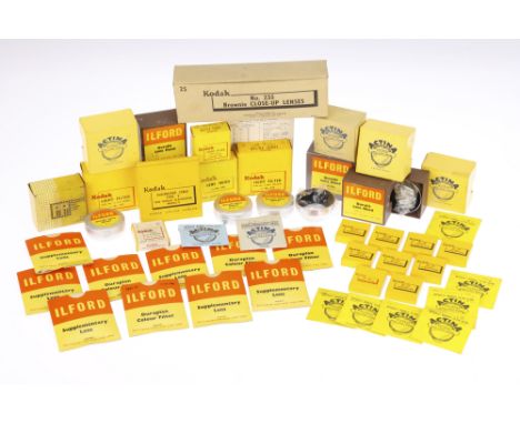 A Selection of Boxed Camera Accessories, to include a retailer's box of 9 Kodak 235 Brownie close-up lenses, in maker's boxes