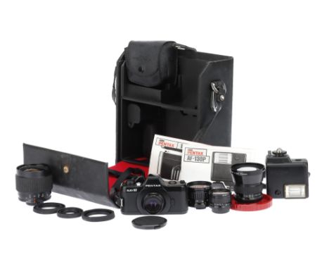 An Asahi Pentax Auto 110 SLR Camera Outfit comprising a Pentax Auto 110 camera, black, serial no.1332102, with Pentax-110 f/2
