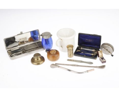 A Good Collection of Medical Instruments, including a creamware spitoon, a Bristol blue glass pocket spitoon, 2 white metal i