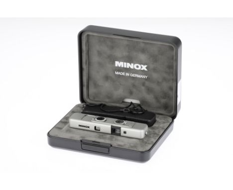 A Minox TLX Sub-Miniature Camera, 1995, titanium, serial no.2603448, with a Minox f/3.5 15mm lens, body E, shutter sticking, 