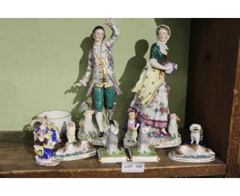 A selection of porcelain figurines, animal and human with a Meissen cup.