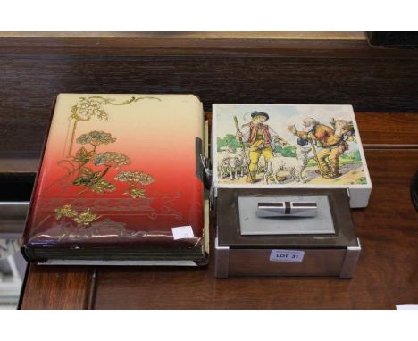 An Oriental design album of 20th century&nbsp;family portrait photographs, together with a boxed multi imaged cube jigsaw, an