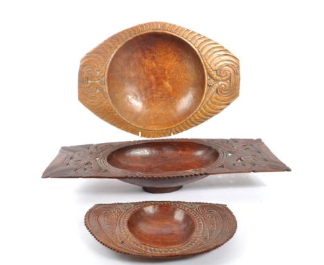 A collection of three vintage 20th century Trobriand Island - Papua New Guinea wooden carved bowls. With geometric carved swi