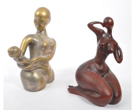 A contemporary brass worked mother and child minimalist sculpture of heavy cast form - 20th century. Together with another wo