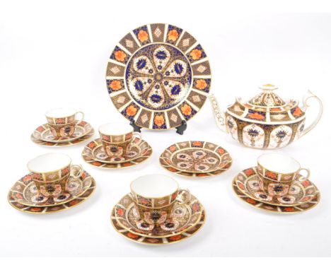 Royal Crown Derby - A vintage 20th century Imari pattern tea service set. To include teapot, cups, saucers, side plates (trio