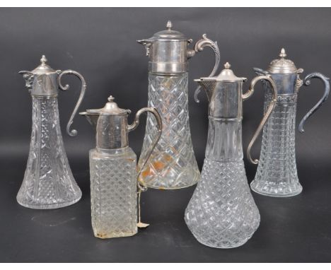 A collection of 20th century Silver Plate cut crystal glass claret jugs / decanters. The collection to include five jugs in t