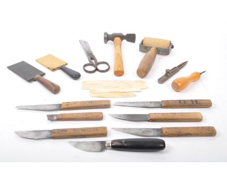 A collection of mid Century and later vintage leather making tools to include scissors, leather cutting knives, various other