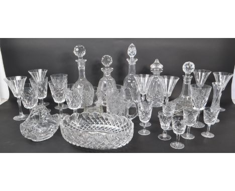 A large collection of 20th Century vintage cut glass crystal items to include five decanters with stoppers, wine glasses, she