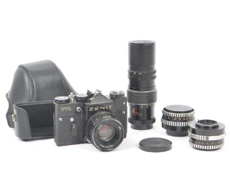Zenit - A late 20th century circa 1970s Zenit TTL 35mm SLR camera alongside a collection of M42 screw mount lenses. The Zenit