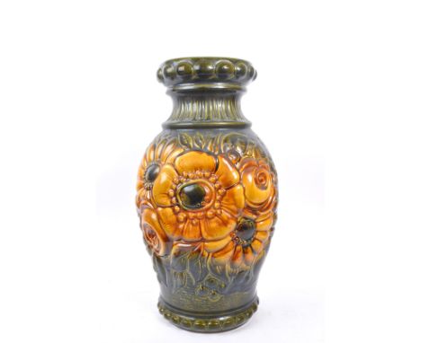 A large 20th century West German vase. The vase having green and yellow colourway with relief sunflower pattern. Model no. 28