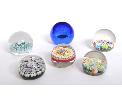 A collection of 20th century millefiori studio art glass paperweights. The collection to include five paperweights of varied 