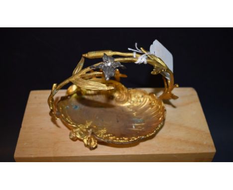 A French gilt metal shell shaped  trinket dish, floral scroll handle, 12cm diam, c.1870