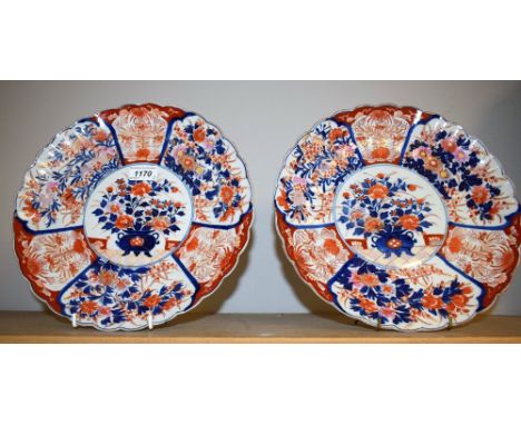 A pair of Japanese Imari fluted circular plates, Meiyi period 