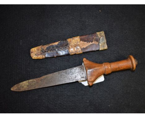 A Sudanese dagger, 13.5cm tapered blade, hardwood grip with centre girdle and disc pommel, hide scabbard, 24cm long overall, 