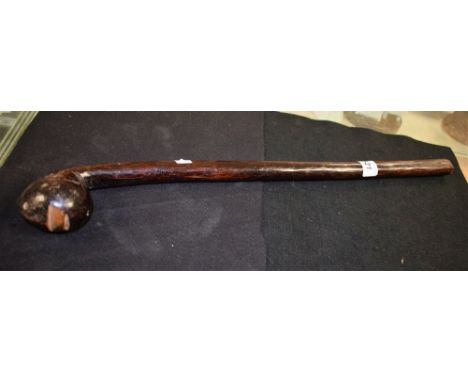 Tribal Art - an African hardwood club or throwing weapon, the ridged head card with a stylised face, 51cm long, 19th/early 20