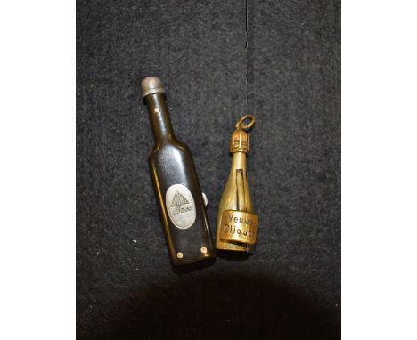 A Novelty Veuve Cliquot Champagne bottle cigar cutter, 45mm high;  a Bass beer bottle shaped two bladed pipe cleaning pocket 