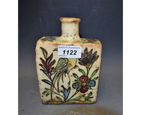A Middle Eastern pottery rectangular flask, painted in the Iznik palette with stylised flowers, 16cm high