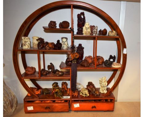 A collection of Japanese hardwood Netsuke, various forms including mythical animals, deity's, scenes of folklore; etc, 20th C