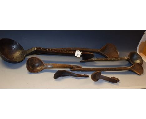  A large hardwood ladle, chip-carved stem, 55cm long; other spoons, similar