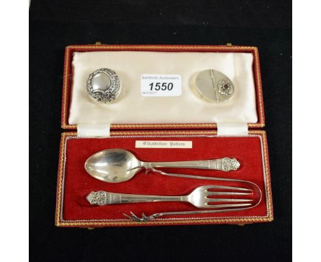 An early 20th century silver christening spoon and fork, hallmarked, cased en suite; double hinged silver pill box; silver Ro