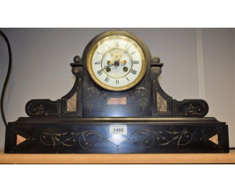 A Victorian black slate and marble clock