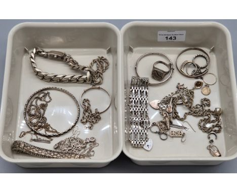 A Collection of silver jewellery; heavy silver curb bracelet, silver bangles, gate bracelet, charm bracelet, various rings an