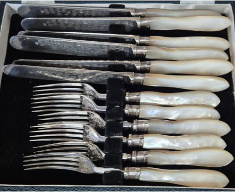 Antique Mother of Pearl Handle Knife &amp; Fork set. Fitted with Sheffield silver collars. Comes with a box. 