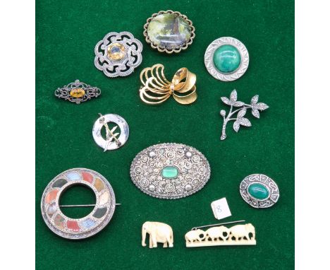 A Collection of antique and vintage brooches; Palestine marked brooch with fitted green centre stone. Ruskin pottery green an