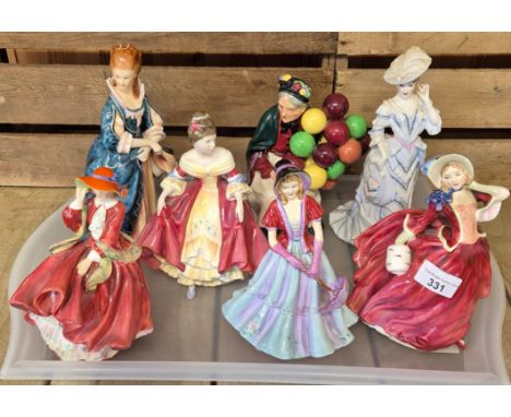 A collection of seven porcelain figurines; Two Early Royal Doulton figurines; The Old Balloon Seller HN1315 &amp; Royal Doult