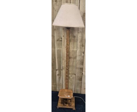 A Vintage hand carved Floor standing lamp with a hand carved elephant table attached. With shade. 184cm high. 