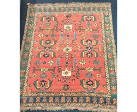 Large hand knotted Persian red ground rug. 300x248cm. 