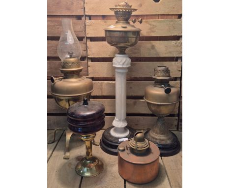A Selection of 19th century oil lamps and reservoirs. Terracotta, marble and brass oil lamp. Arts and crafts brass oil lamp a