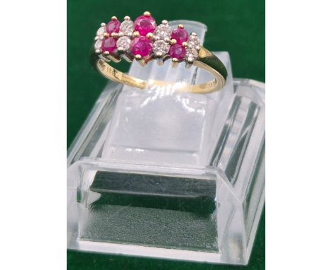 18ct yellow gold Ruby &amp; Diamond stone ring. 0.25cts diamonds. Six Round cut rubies and eight round cut diamonds. 3.21gram