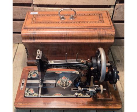 Antique Frister &amp; Rossman hand crank sewing machine. Comes with wooden carry case. 