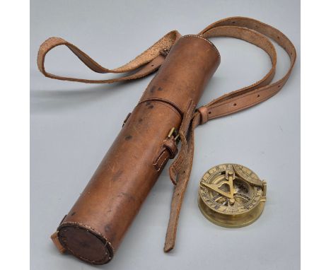 Two section pull scope within a leather casing and brass compass. 