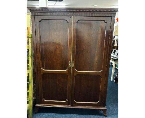 19th century double wardrobe, in the manner of Titchmarsh &amp; Goodwin. Having fitted interior hanging hooks, rails and two 