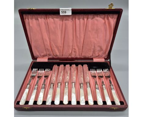 Silver plated and mother of pearl handle fork and knife set within a fitted display box. [Complete] 